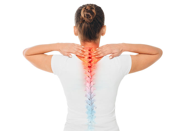 The image shows a person with a back injury, leaning forward with their hands on their knees, displaying a visible spine with a red area indicating pain or inflammation.